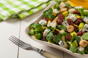 Italian salad with avocado, gorgonzola cheese.