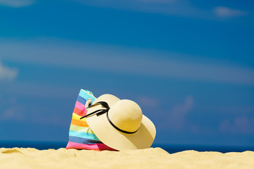 Fototapeta na wymiar Beach accessories - bag and straw hat
