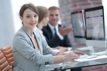 young business woman sitting at the Desk