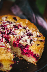 Homemade cherry pie on a wooden chair in the garden
