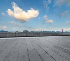 Panoramic skyline and buildings with empty square floor.