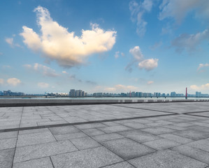 Panoramic skyline and buildings with empty square floor.