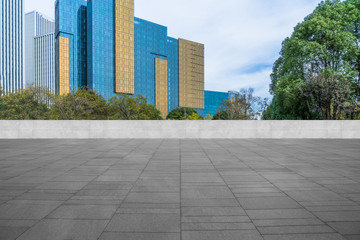 Plakat modern buildings and empty pavement in china.