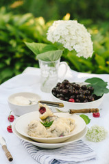 Homemade traditional Russian Ukrainian dumplings, vareniki with cherries