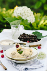 Homemade traditional Russian Ukrainian dumplings, vareniki with cherries