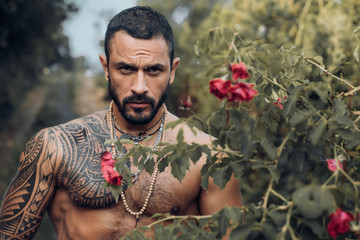 Confident and handsome Brutal man. Stylish sexy man looking away. Portrait of handsome male model. Brutal handsome man with tattooed body. Men fashion Brutal models.