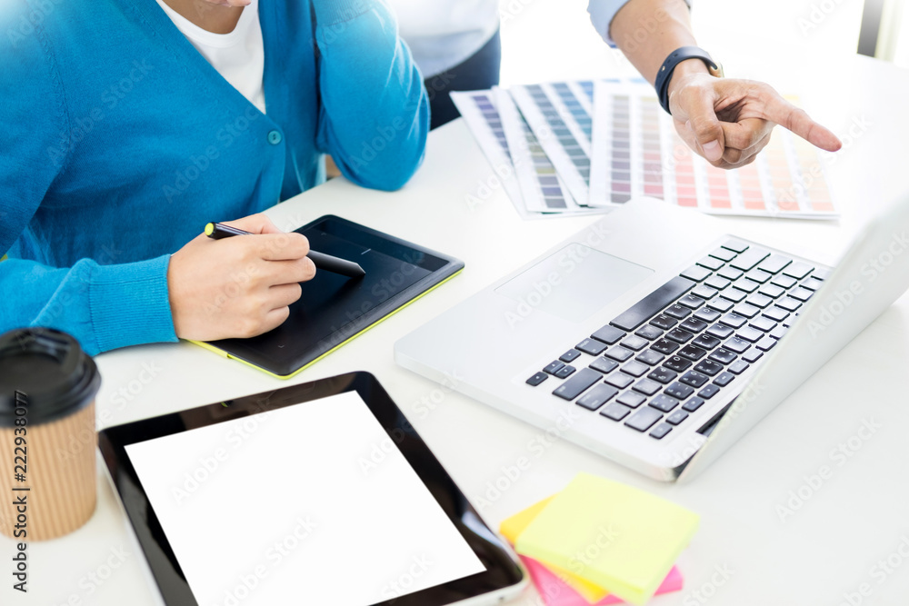 Poster creative or interior designers teamwork with pantone swatch and building plans on office desk, archi