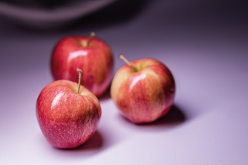 Three beautiful apples on the background.
