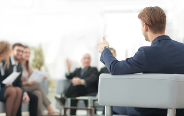 image is blurred.businessman conducting a meeting