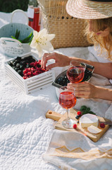 women in a straw hat on a picnic outdoors
