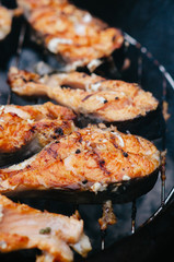 Grilled salmon on the flaming grill