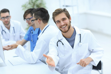 friendly doctor making a welcome gesture
