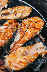 Grilled salmon on the flaming grill