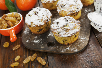 Mandarin muffins with raisins on the table