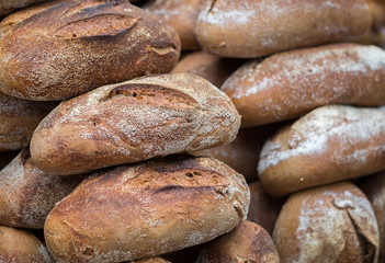 Fototapeta na wymiar Close-up shot of dark bread for sale at farmers market