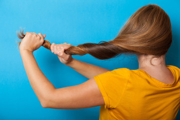 Woman hair problem concept, healthy long brunette.
