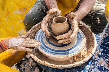 Process of rotation of potter's wheel, hands of ceramist