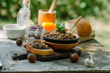Traditional Caucasian saute from stewed eggplants, peppers, onions, tomatoes and herbs on the old...