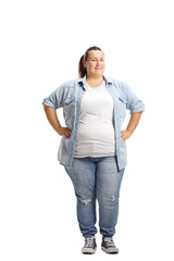 Overweight woman standing with hands on her waist