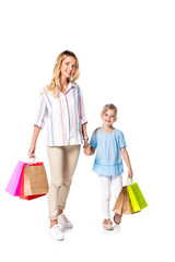 mother and daughter with shopping bags isolated on white