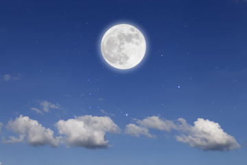 Fototapeta na wymiar Romantic night with full moon in space over stars with cloudscape background.