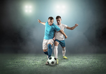 Fototapeta na wymiar Soccer player on football field in dynamic action at summer da