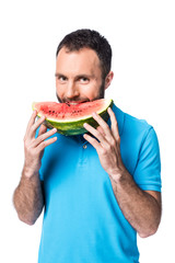 man in blue polo eating watermelon isolated on white