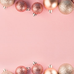 Pink baubles in row on pink