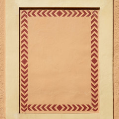 Decorative frame on an old house wall