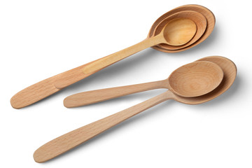Wooden spoons of different sizes on a white background