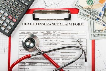 Stethoscope and calculator symbol for health care costs or medical insurance