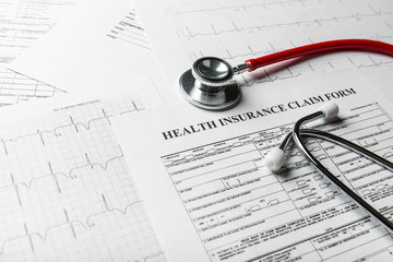 Health insurance form with stethoscope