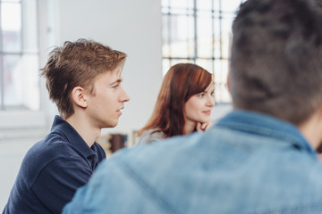 Young businessman or student in a meeting