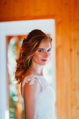 Fototapeta premium Beautiful young bride on blurred color background