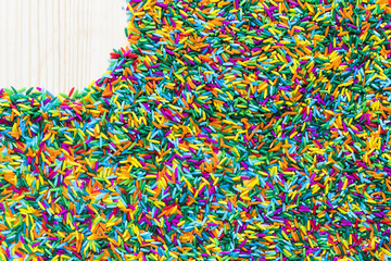 Fototapeta premium Left Copyspace on colorful rice on wooden background