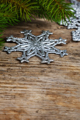 Silvery snowflakes and fir branches