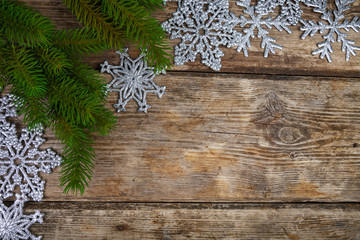 Silvery snowflakes and fir branches