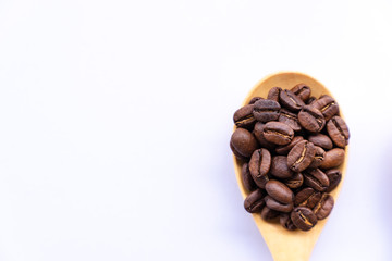 top view close up coffee bean on wooden spoon