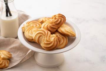 Homemade cookies with a bottle of milk.