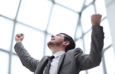 close up.very happy businessman in his office