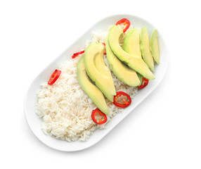 Plate with tasty boiled rice and vegetables on white background