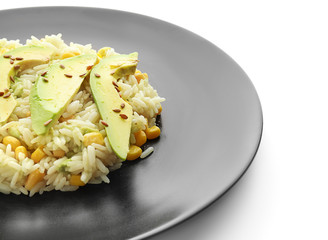Plate with tasty boiled rice and vegetables on white background, closeup