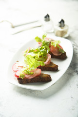 Pickled radish salad on toast