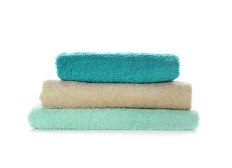 Fototapeta na wymiar Stack of clean soft towels on white background