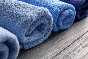 Obraz na płótnie Canvas Clean soft towels on wooden table, closeup