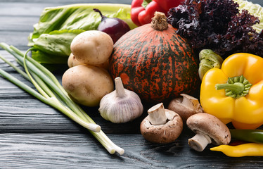 Various fresh vegetables on wooden table
