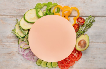Composition with fresh vegetables and blank card for text on wooden background