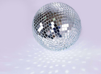 beautiful disco ball on yellow background isolated.