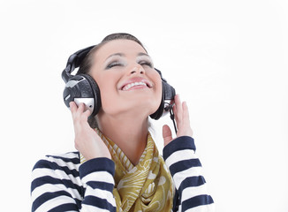 closeup .stylish girl listening to music with headphones
