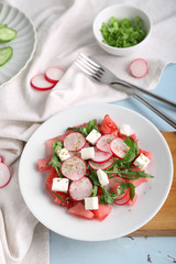 Plate with delicious watermelon salad on table